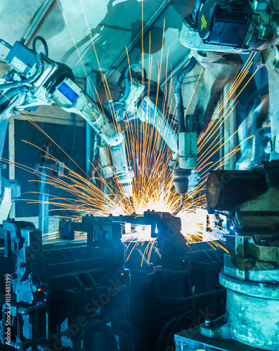 Welding robots movement in a car factory