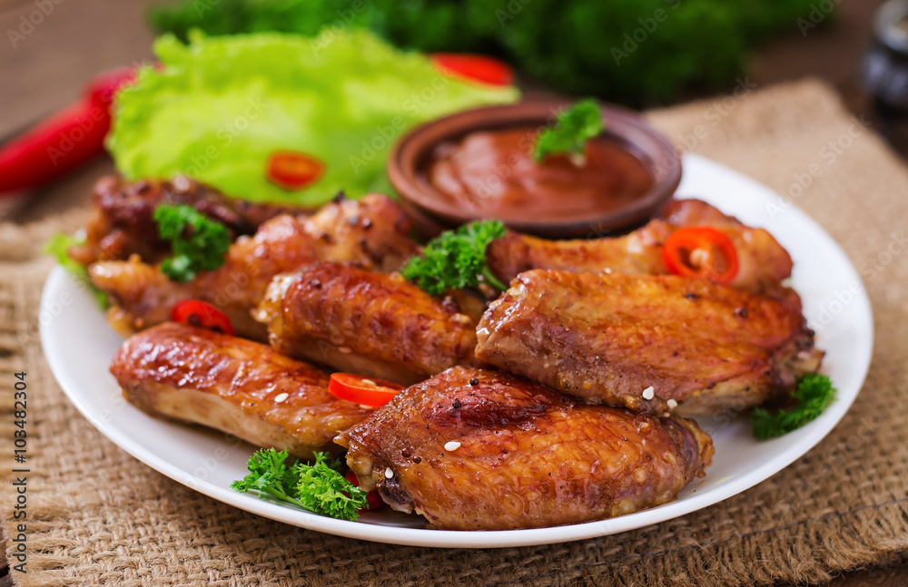 Sour-sweet baked chicken wings and sauce