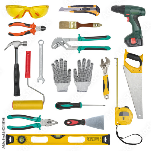 Set of construction tools isolated on a white background. Level, saw, glasses, tape measure, wrench, spanner, paint roll, hammer, cutter, pliers.