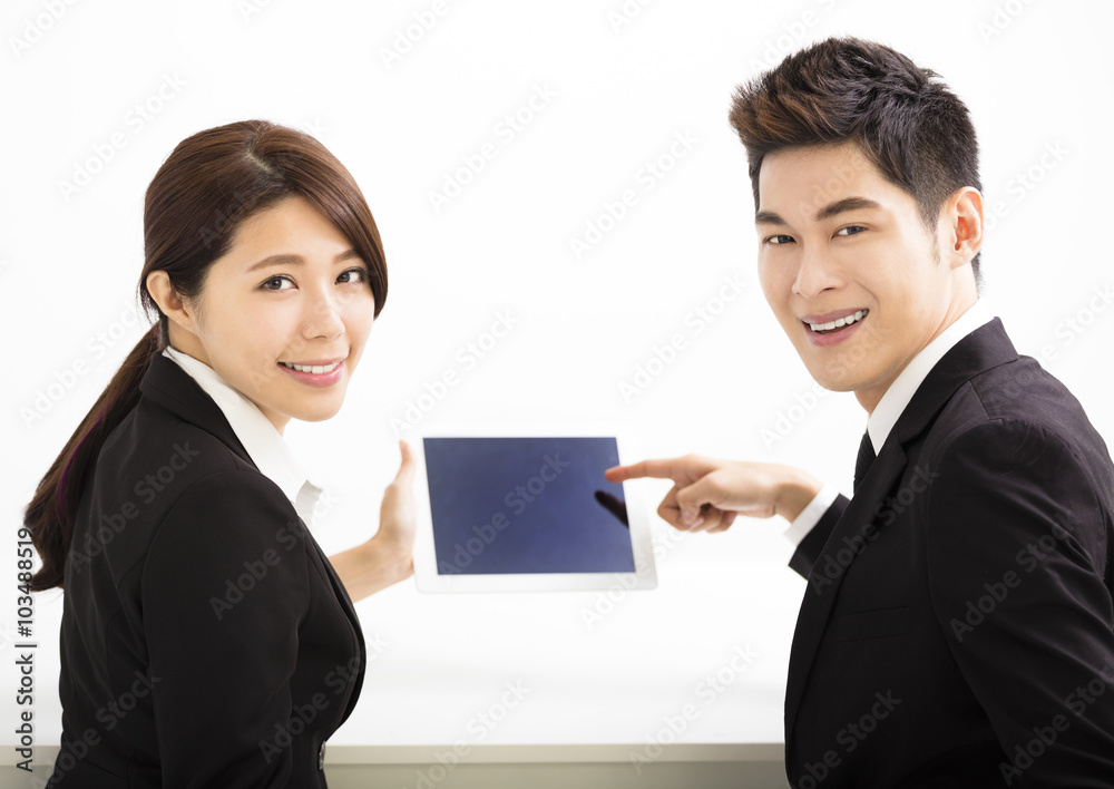 Happy business man and woman holding tablet Happy business man and woman holding tablet