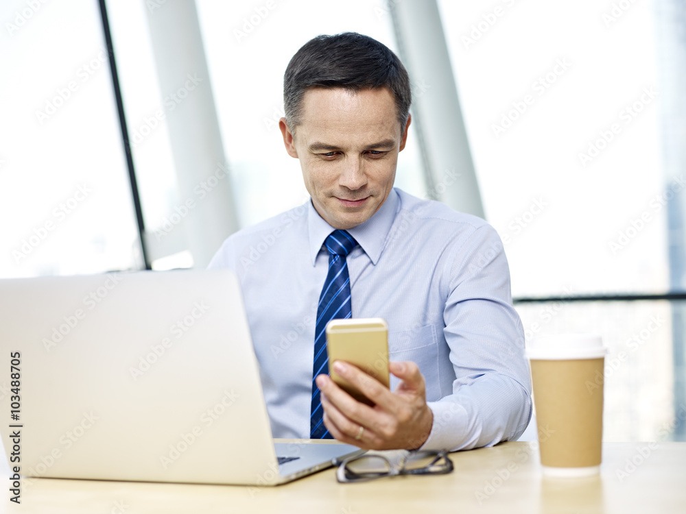 Business people working in office with cellphone and laptop Business people working in office with cellphone and laptop