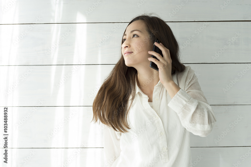 Beautiful woman is talking on smartphone Beautiful woman is talking on smartphone