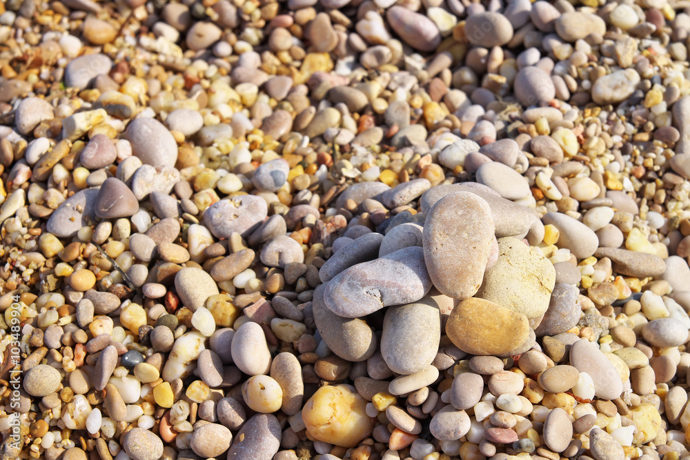 Naklejka premium Colourful stones, pebbles on the beach.