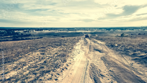 rolled road in a sandy field