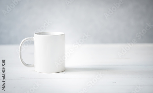 white cup on a table