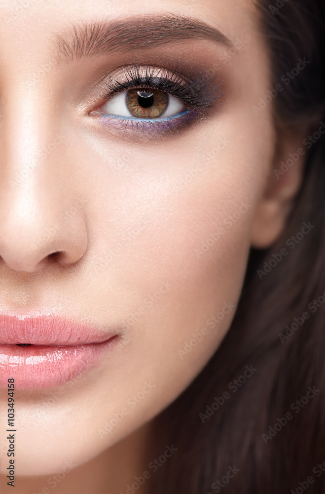 Half face female beauty portrait with aqua Limpet Shell color ey Half face female beauty portrait with aqua Limpet Shell color ey