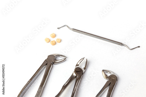Dental instruments. Dentures and medical equipment on white background © alexionutcoman