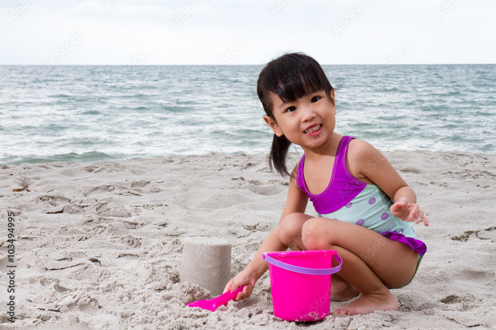 Asian Little Chinese Girl Playing Sand with Beach Toys Asian Little Chinese Girl Playing Sand with Beach Toys