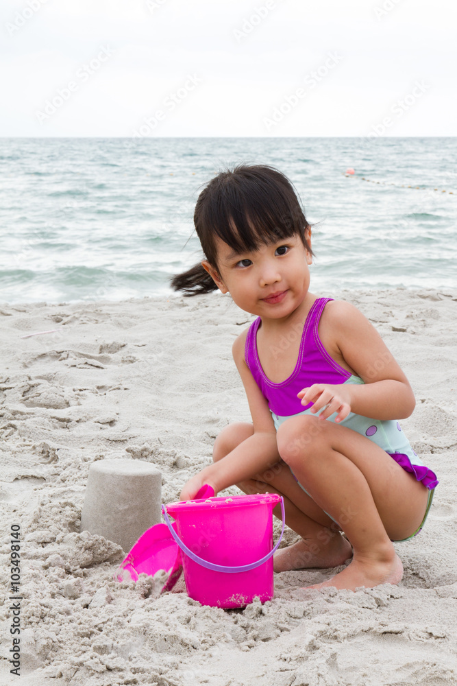 Asian Little Chinese Girl Playing Sand with Beach Toys Asian Little Chinese Girl Playing Sand with Beach Toys