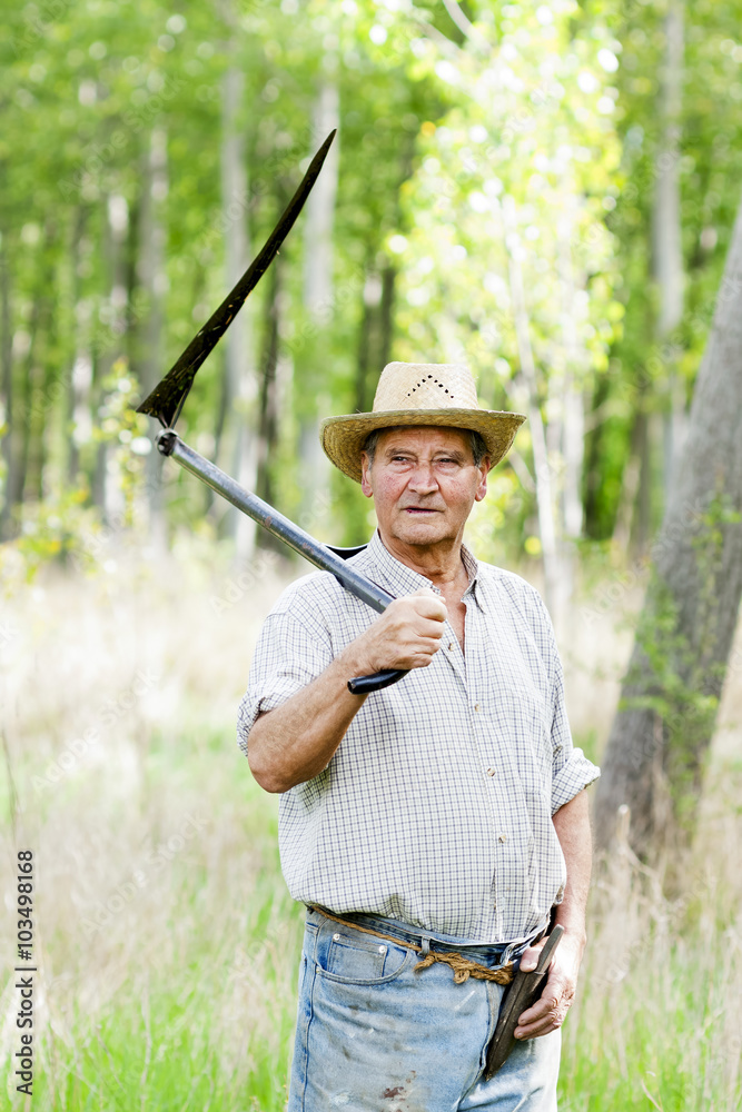 reaper man with a scythe for mow the grass in the field reaper man with a scythe for mow the grass in the field