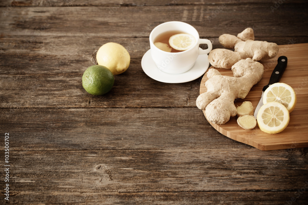 cup of ginger tea on a wooden table cup of ginger tea on a wooden table