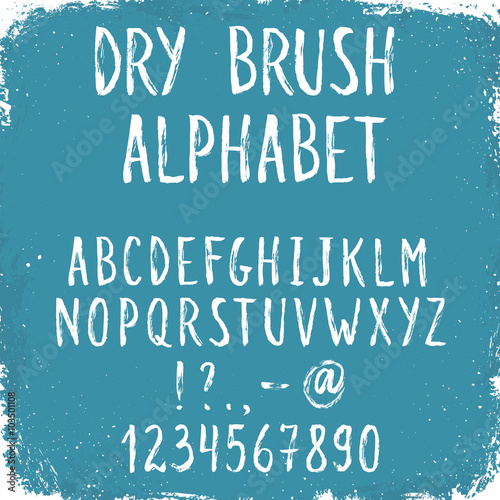Hand drawn tall and narrow letters. Handwritten alphabet on blue grunge background. Modern chalk typography.
