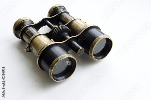 Vintage binoculars on a light background 