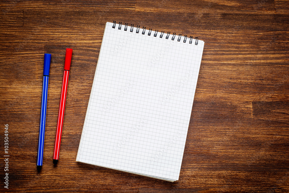 notebook and pen on wood table notebook and pen on wood table