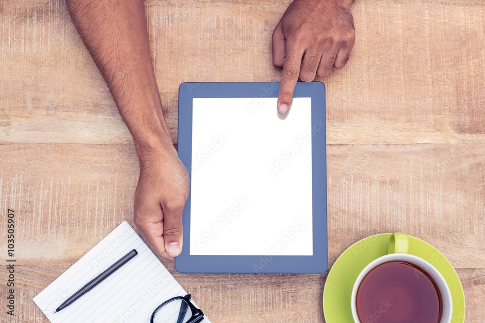 Cropped image of man using on digital tablet