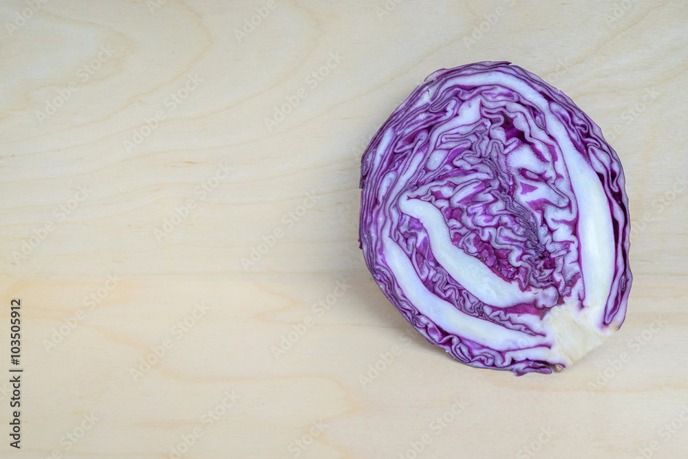Fototapeta premium Purple cabbage on wood