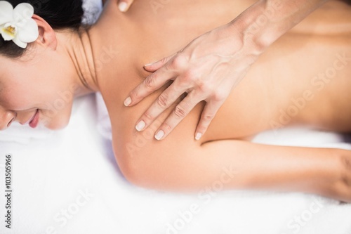 Woman receiving a back massage from masseur