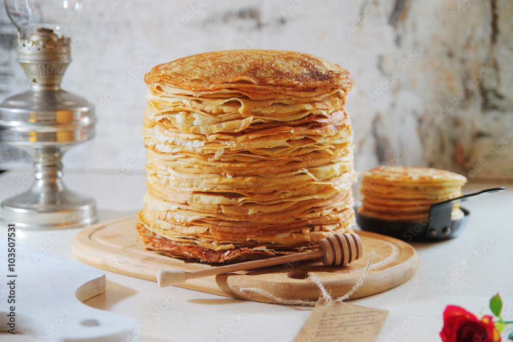 Stack pancakes on Shrove Tuesday on a light background