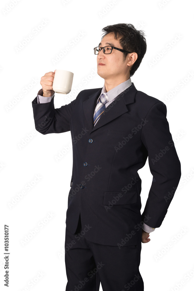 Thoughtful Asian businessman holding cup of coffee and looking a Thoughtful Asian businessman holding cup of coffee and looking a