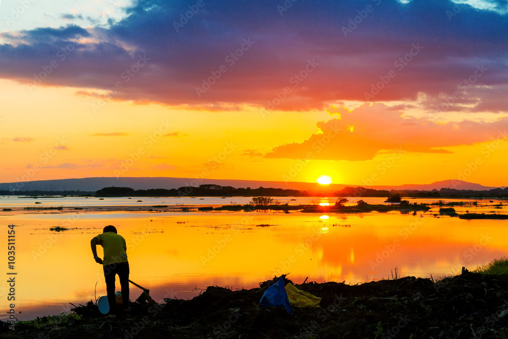 Fototapeta premium Farmer work and sunset
