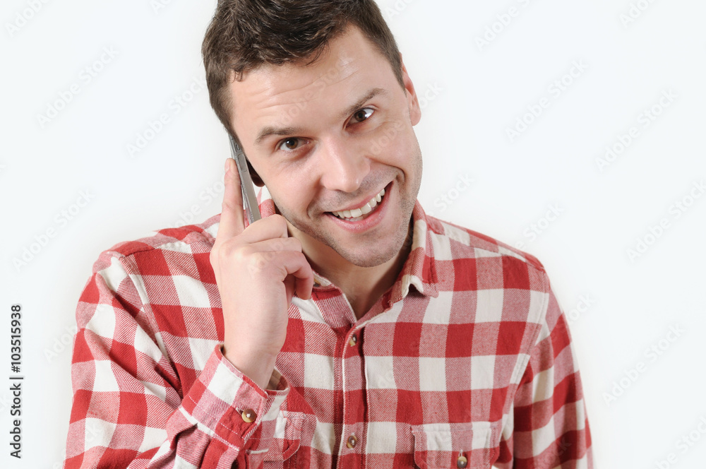 handsome man talking on his mobile phone against a white background handsome man talking on his mobile phone against a white background