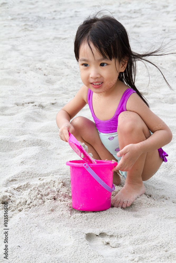 Asian Little Chinese Girl Playing Sand with Beach Toys Asian Little Chinese Girl Playing Sand with Beach Toys