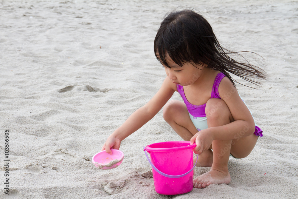 Asian Little Chinese Girl Playing Sand with Beach Toys Asian Little Chinese Girl Playing Sand with Beach Toys
