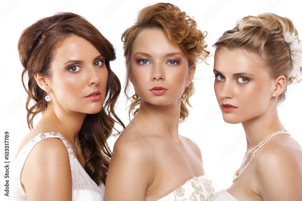 Portrait of a three beautiful woman in wedding dress isolated ov