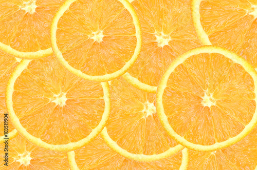 Wallpaper with orange slices. Collage of oranges