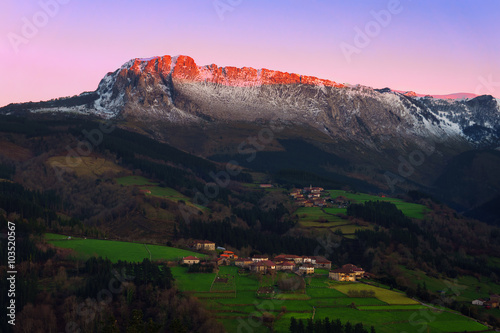 Itxina mountain with Zaloa and Urigoiti villages at sunset photo