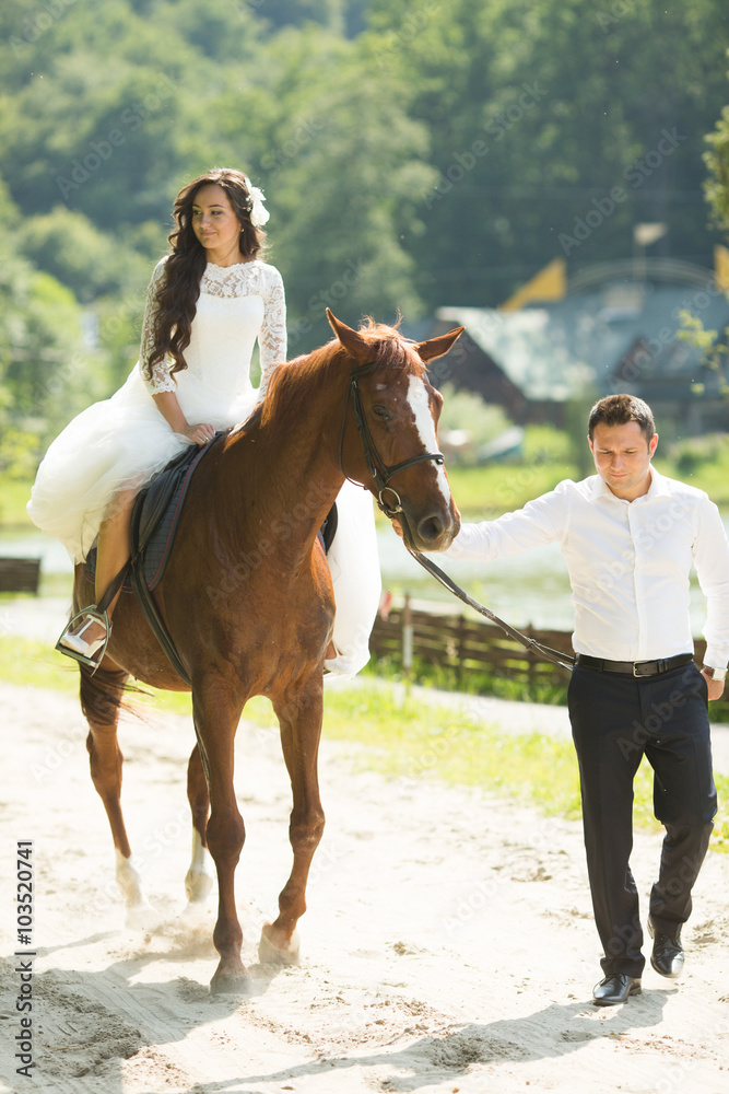 stylish gorgeous happy brunette bride riding a horse and elegant stylish gorgeous happy brunette bride riding a horse and elegant