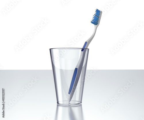toothbrush in glass isolated on white background
