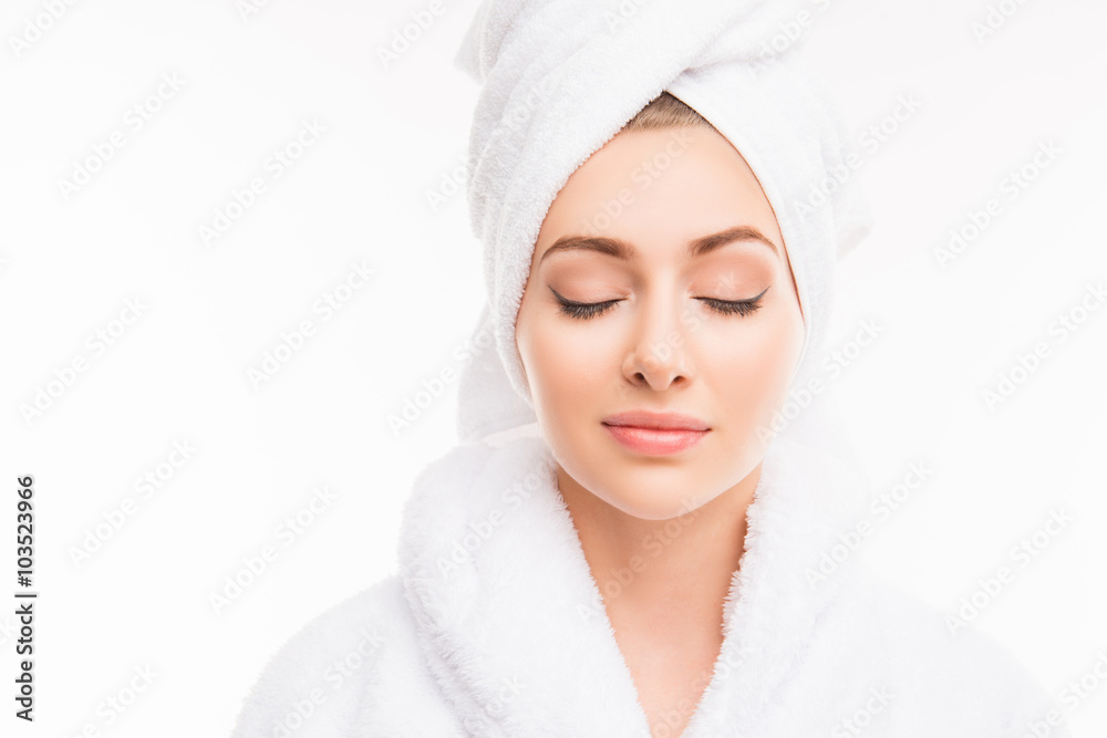 Obraz premium Young pretty cute girl with towel on her head and closed eyes