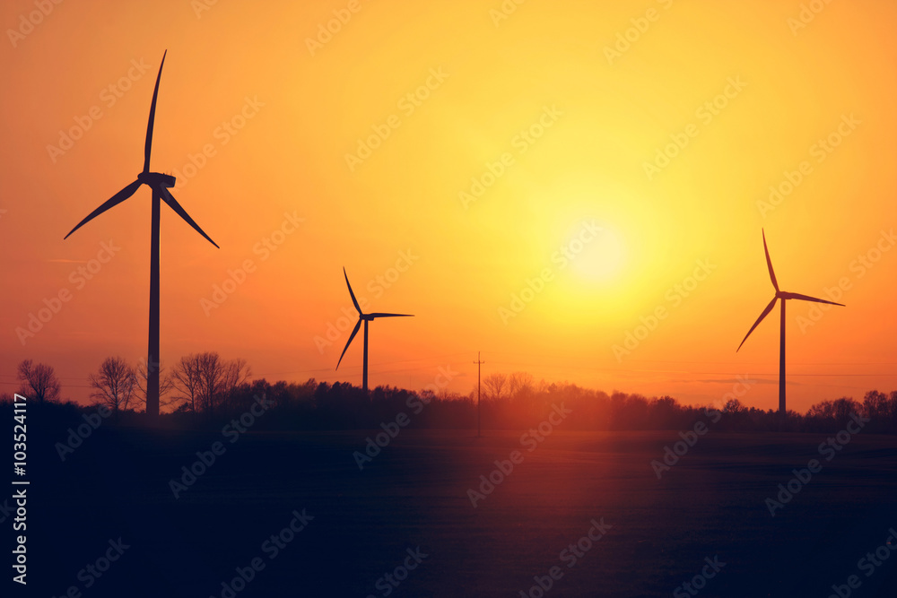 Windmills and sunset.