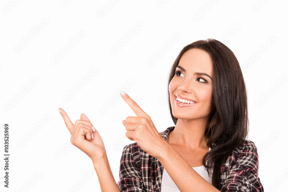 Cheerful pretty girl pointing away, close up photo Cheerful pretty girl pointing away, close up photo