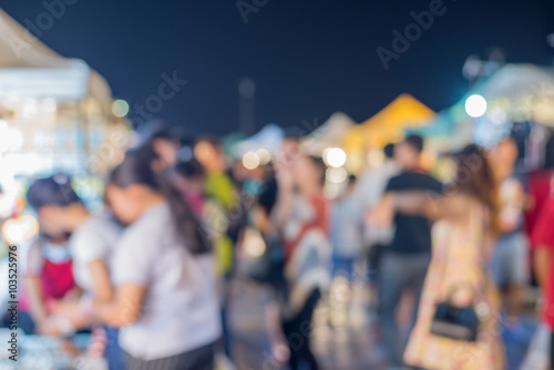 blur background of Crowd at night market 