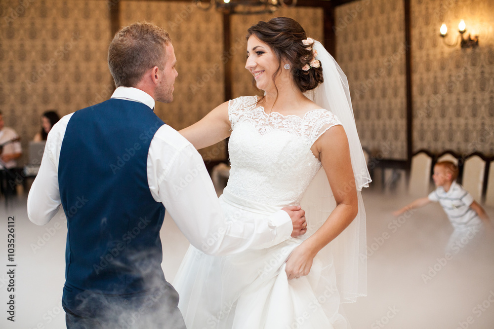 happy elegant gorgeous married couple performing first dance wit