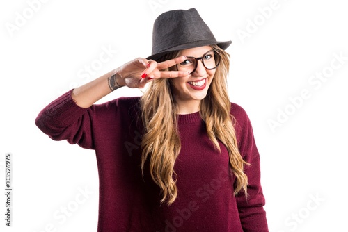 Hipster young girl doing victory gesture