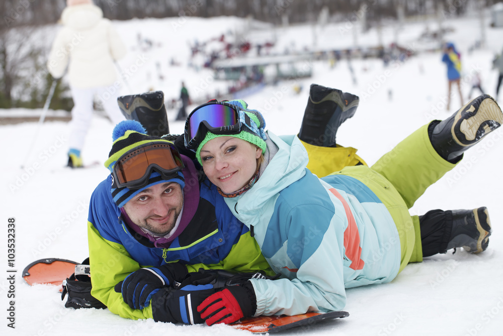 young couple snowboarders rejoice and be glad 