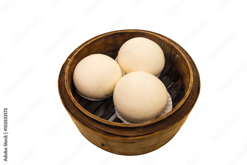 Chinese dim sum 'steamed buns' in bamboo basket isolated on whit Chinese dim sum 'steamed buns' in bamboo basket isolated on whit