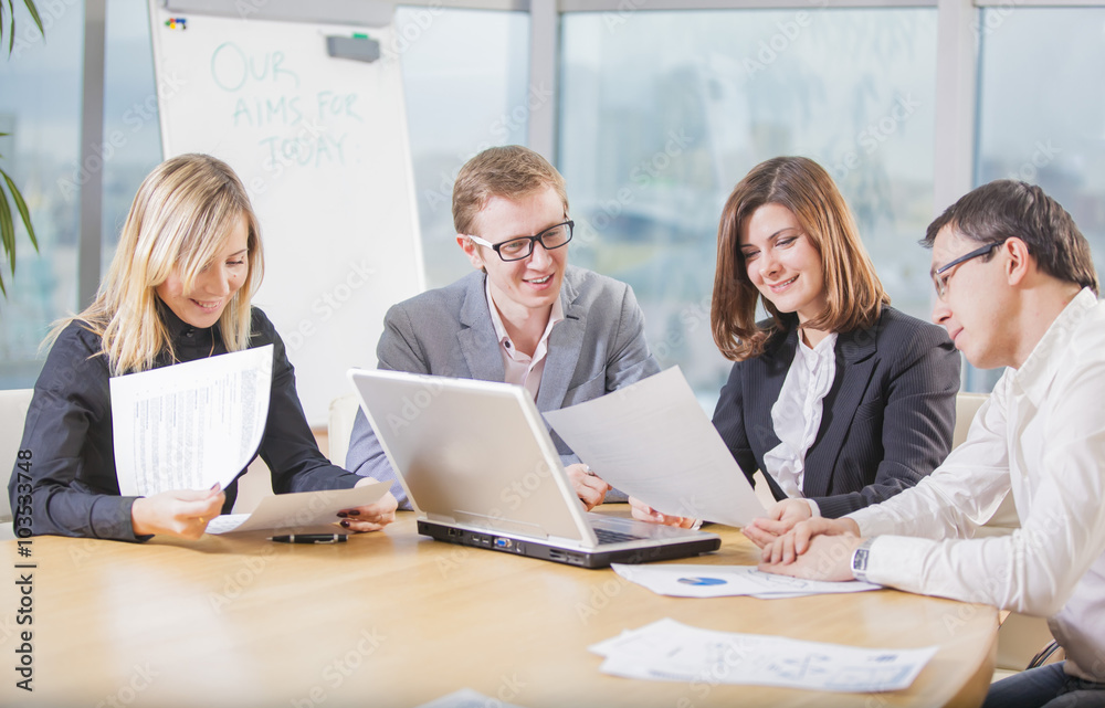 several businesspeople interacting at meeting