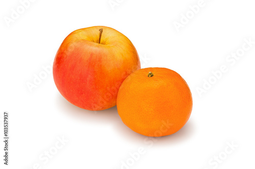 Fresh, juicy, bright apple and mandarin on a white background