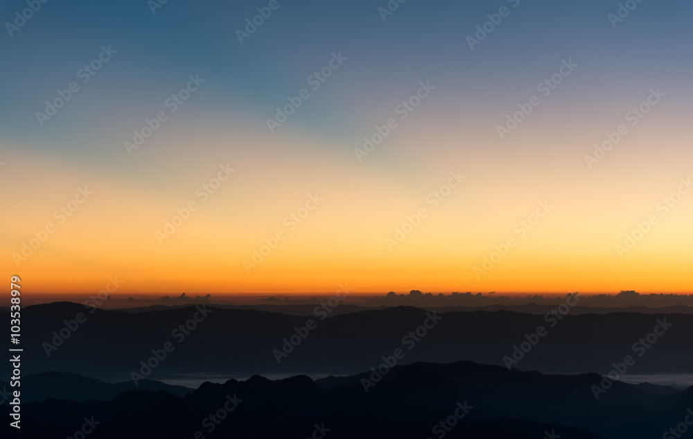 Dramatic sunset and sunrise sky and mountain layer.