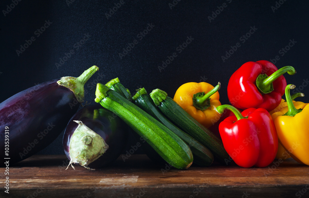 Healthy eating background . Colorful vegetables on wooden table.