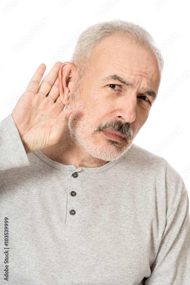 Obraz premium Man holds his hand near his ear and listening something