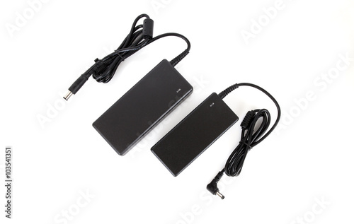 Laptop AC adapter charger Power supply isolated on white background photo