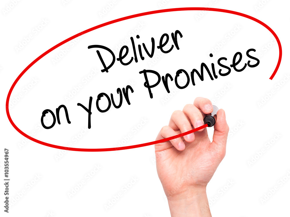 Man Hand writing Deliver on your Promises with black marker on v Man Hand writing Deliver on your Promises with black marker on v