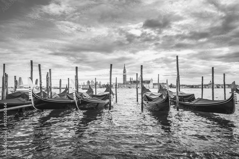 Gondolas in lagoon of Venice and San Giorgio island in background, Italy, Europe, black and white
