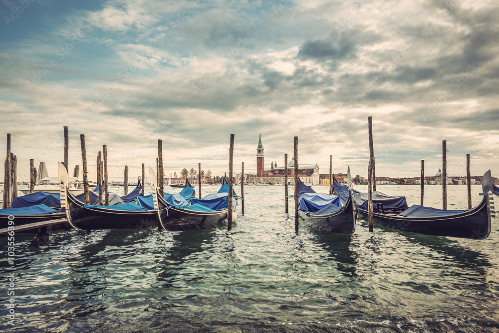 Gondolas in lagoon of Venice and San Giorgio island in background, Italy, Europe, Vintage filtered style
