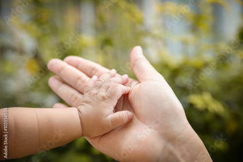 baby hand in mother's palm